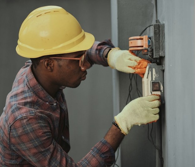 Electrician working on residential panel
